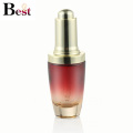 cosmetic packaging 30ml gradient red glass serum bottle with golden press dropper cap